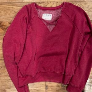 Size M sweater in color red. From Aero.